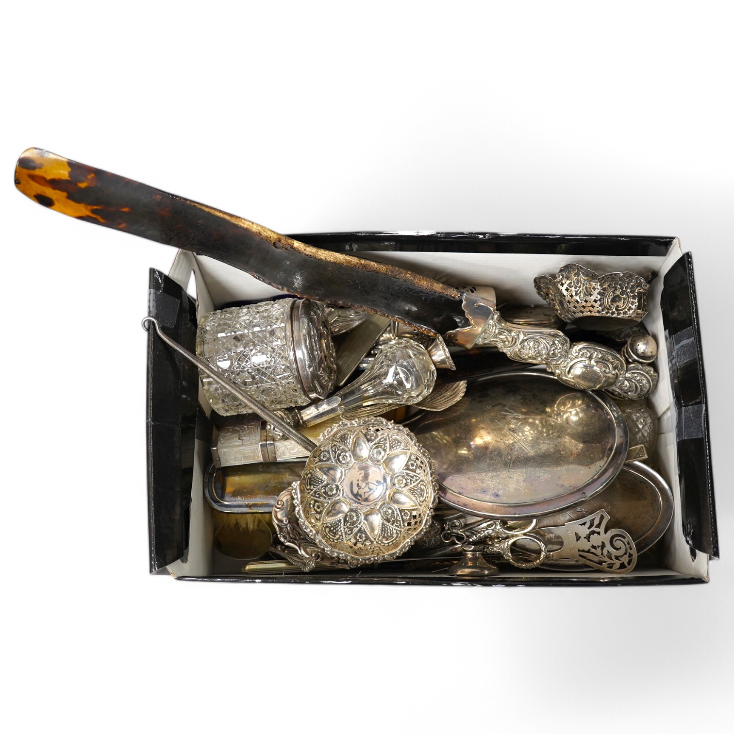 A group of assorted silver etc. including a mounted hand mirror and two brushes, two card cases (both a.f.), caddy spoon, fruit knife, page turners (a.f.), shoe pin cushion, cased folding comb and other mainly damaged it